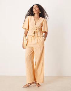 Брюки-комбинезон с цветочной вышивкой абрикосового цвета Asos Design