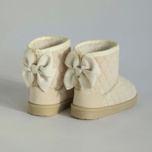 Стеганые сапоги с лентами