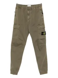 Эластичные брюки с карманами-карго Stone Island, зеленый