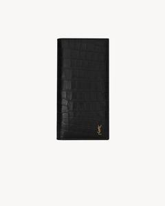 Континентальный кошелек TINY CASSANDRE из матовой кожи с тиснением под крокодила Saint Laurent, черный