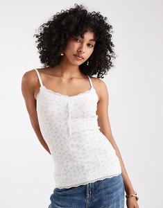 Топ Hollister Y2K с ажурной отделкой и белыми цветочными мотивами