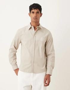 Рубашка ASOS DESIGN с вышивкой на груди из хлопкового поплина цвета пахты