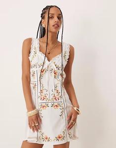 Мини-платье с вышивкой и завязками на бюсте ASOS DESIGN белого цвета