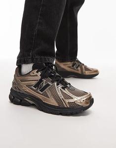 Кроссовки унисекс New Balance 1906R в золотом и черном цвете