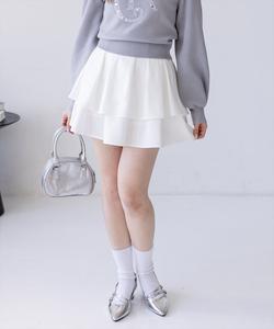 Двухъярусная мини-юбка с оборками и завязками на спине.