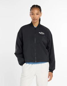 Куртка-бомбер New Balance Linear Heritage из плетеной ткани черного цвета