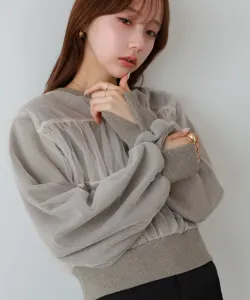 Короткая толстовка из тюля, надетая поверх другой одежды.