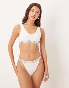 Трусики-танга Heritage Cotton ярко-белого цвета Calvin Klein