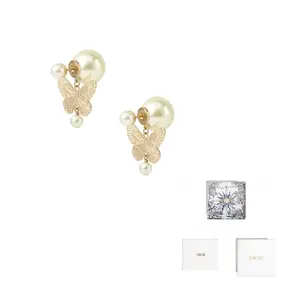 Металлические, смоляные серьги женские золотые DIOR