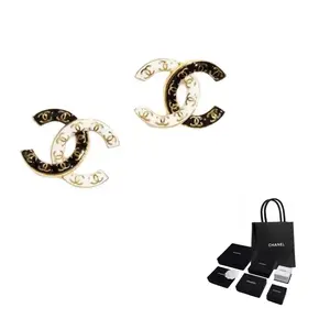 CHANEL Металлические серьги-гвоздики Women's Black/White