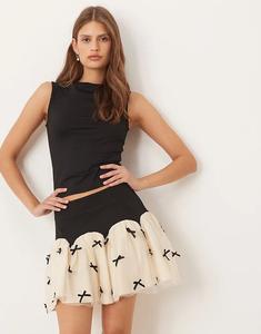 Мини-юбка Never Fully Dressed с контрастным бантом и заниженным подолом черного и кремового цветов