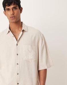 Рубашка свободного кроя из премиального льна ASOS DESIGN с вышивкой на груди кремового цвета