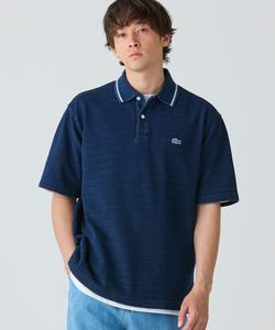 Поло-рубашка из трикотажа в рубчик, подобранная по цвету. Цвет: индиго.