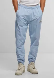 Спортивные брюки с нашивкой - неотъемлемый элемент спортивного костюма. Karl Kani, Light Blue