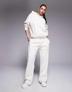 Кремовые спортивные брюки с тисненым логотипом Kaiia