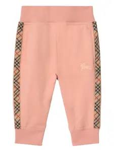 Хлопковые спортивные брюки с клетчатой отделкой BURBERRY KIDS, розовый