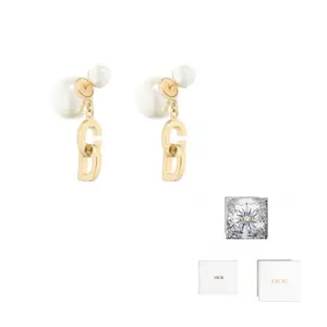 DIOR Смоляные металлические серьги Women's Gold
