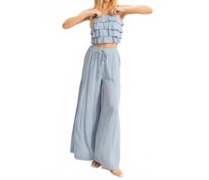 Комплект из топа с рюшами и струящихся брюк синего цвета HYFVE