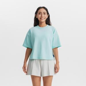 Женская базовая футболка Decathlon SPORTSWEAR укороченная свободного кроя мятного цвета