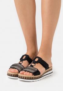 Мюли на плоской подошве Rieker, цвет schwarz/natur