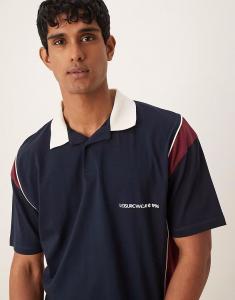 Свободное поло свободного кроя с принтом на груди ASOS DESIGN темно-синего цвета