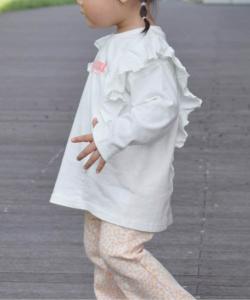 Эксклюзивная футболка с длинными рукавами и оборками, доступная только в интернете.