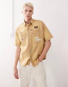 Рубашка Aape by A Bathing Ape с короткими рукавами бежевого цвета с вышивкой на спине AAPE BY A BATHING APE