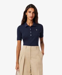 Поло с короткими рукавами, выполненное в технике ажурной вязки с кружевной отделкой.