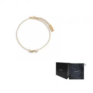 SAINT LAURENT Латунный браслет женский золотой