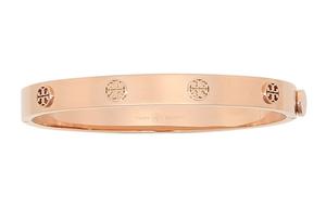 Миллер с шипами на шарнирном браслете TORY BURCH, розовое золото