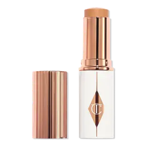Увлажняющий тональный крем-стик Unreal Skin Sheer Glow Tint Charlotte Tilbury, 8 Medium (medium-tan with warm undertones)