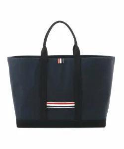 Сумка для инструментов среднего размера из промасленной ткани.