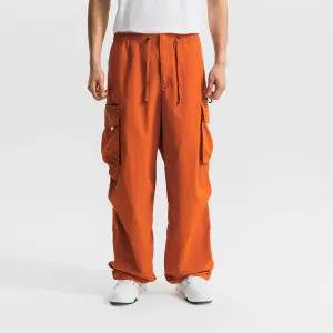 Унисекс спортивные брюки SPORTSWEAR городские функциональные с несколькими карманами в стиле карго терракотового цвета Decathlon