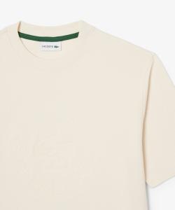 Толстовка с короткими рукавами, ворсистой подкладкой, графической вышивкой и строчкой в тон ткани.