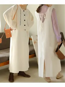 Комплект из кардигана и платья-свитера с косами.