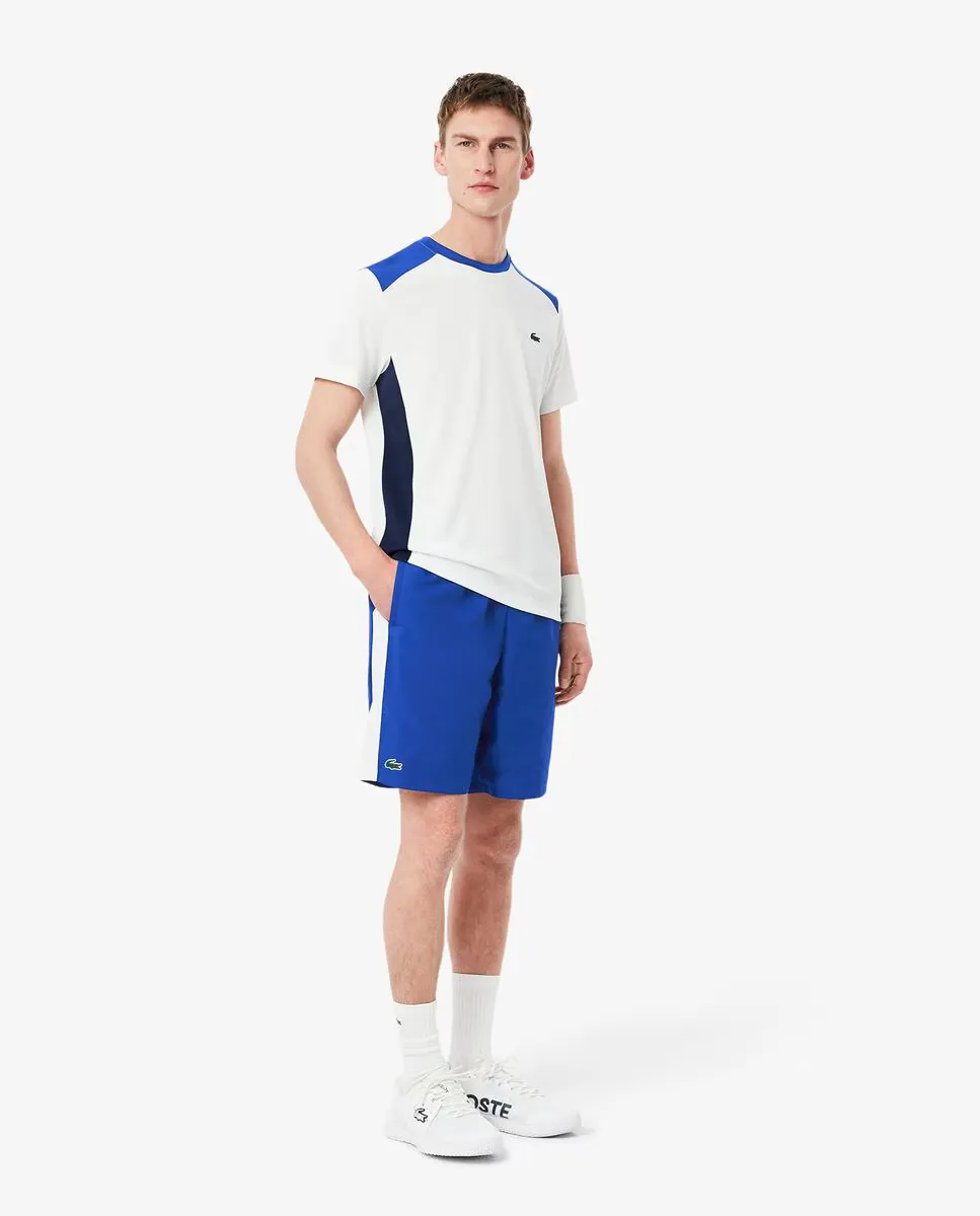 

Мужские спортивные шорты с принтом и фирменной символикой Lacoste, синий