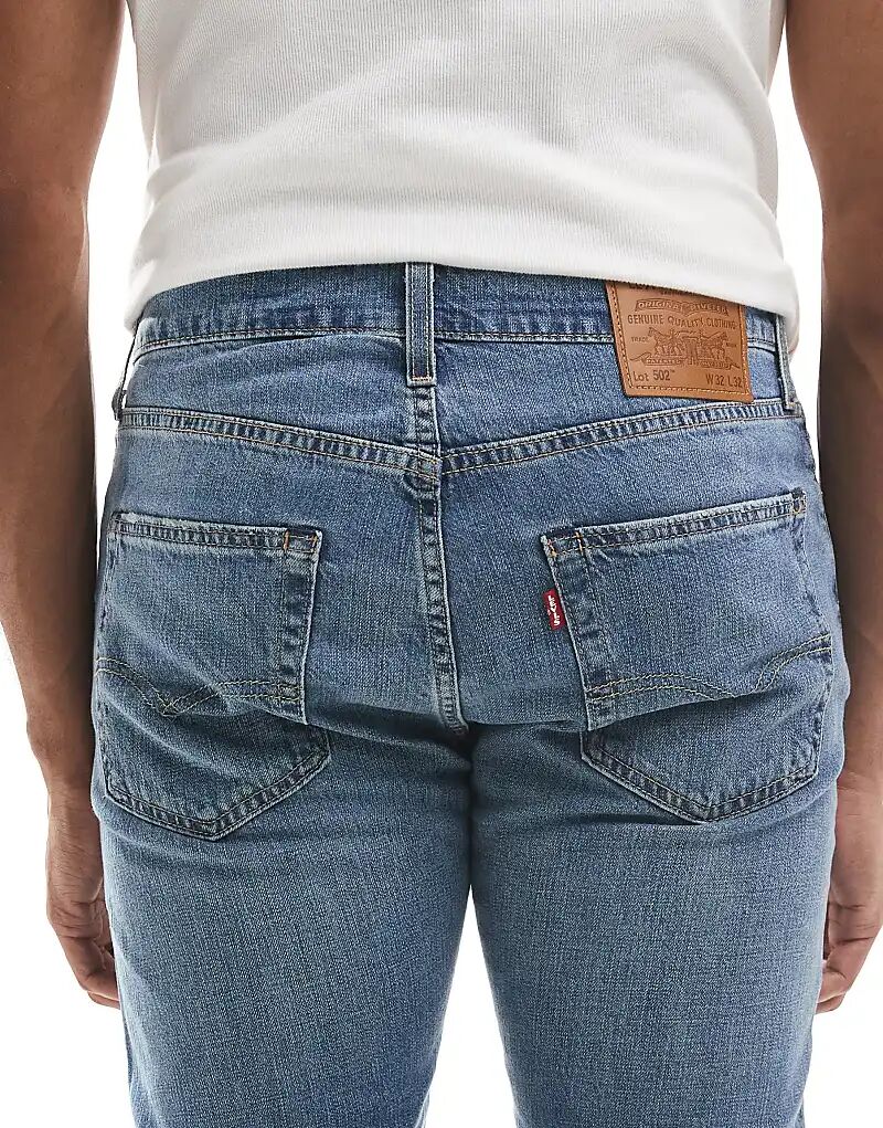 Джинсы Levi's 502 зауженного кроя светлого цвета — фото 4