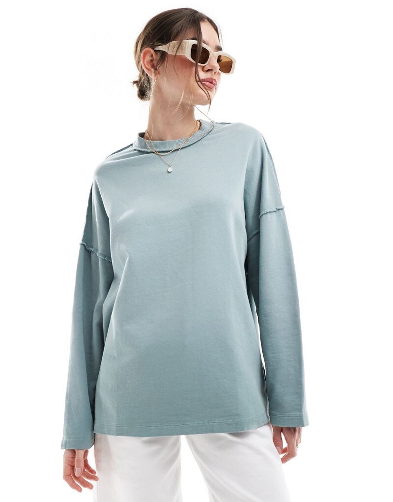 

Серый свитшот с открытыми швами ASOS DESIGN