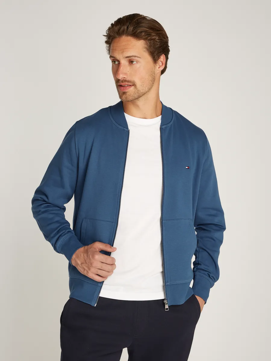 

Толстовка Tommy Hilfiger "FLAG LOGO BASEBALL ZIP TRUGH", цвет Aegean Sea