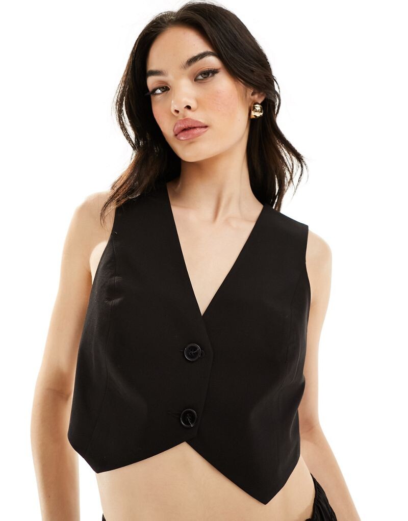 

Черный короткий жилет ASOS DESIGN