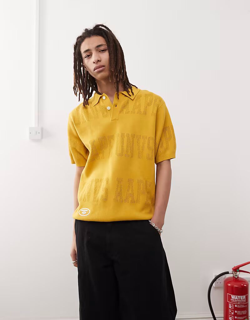 

Трикотажное поло с монограммой и логотипом Aape by A Bathing Ape горчично-желтого цвета AAPE BY A BATHING APE
