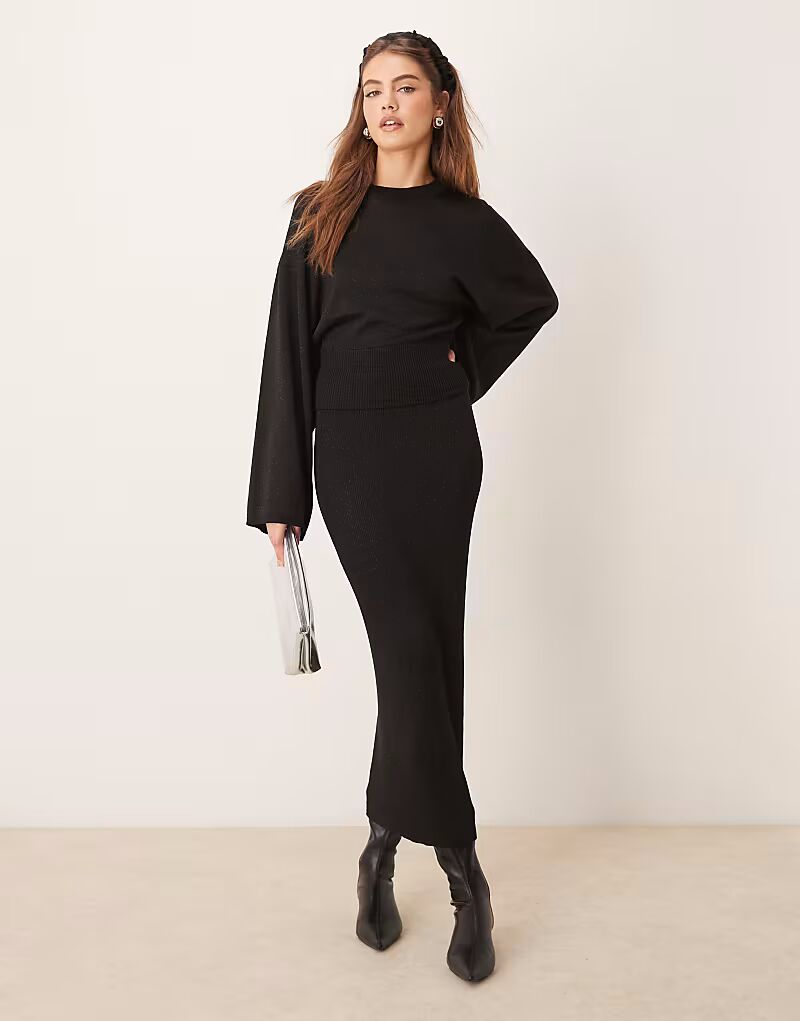 

Юбка макси из тонкого трикотажа Gina Tricot черного цвета с металлическим оттенком
