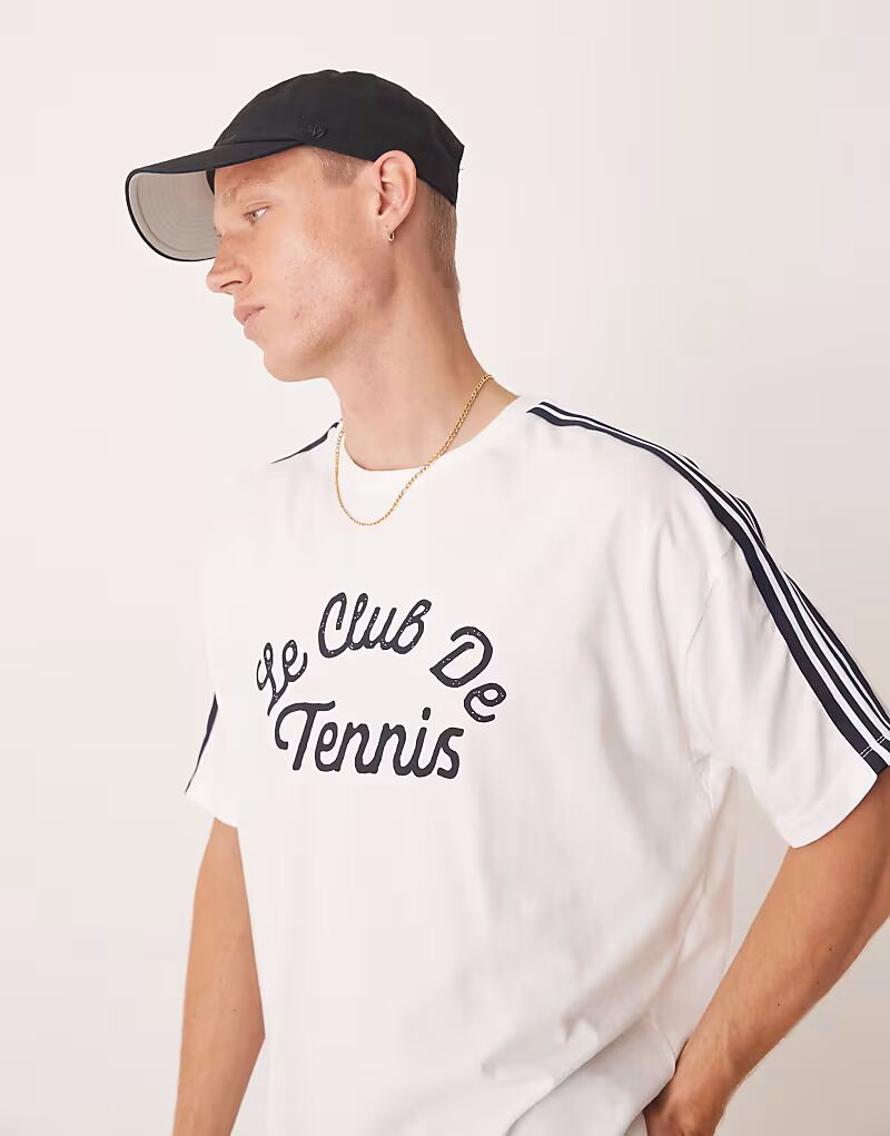 

Футболка свободного кроя ASOS DESIGN свободного кроя со спортивной графикой и лентой белого цвета