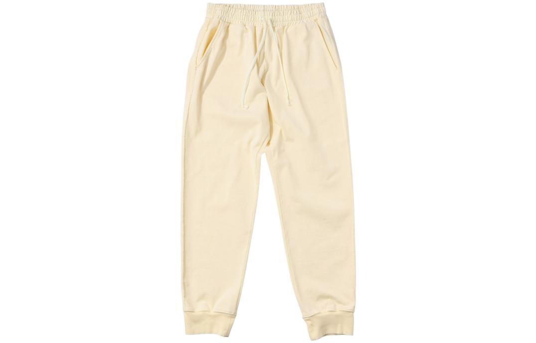 

Трикотажные спортивные штаны унисекс бежевый New Balance, цвет Apricot Cream