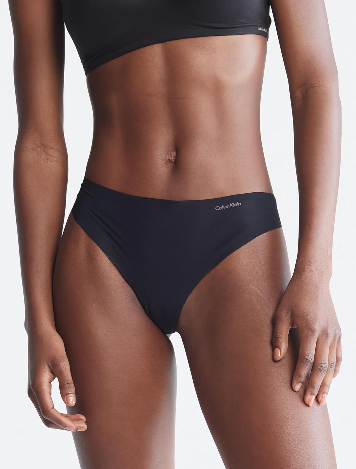 Женские бесшовные трусики-стринги Calvin Klein Invisibles, 5 шт., Black/Wind Chime/Luminous Peach/Cedar/Lime Cream — фото 2