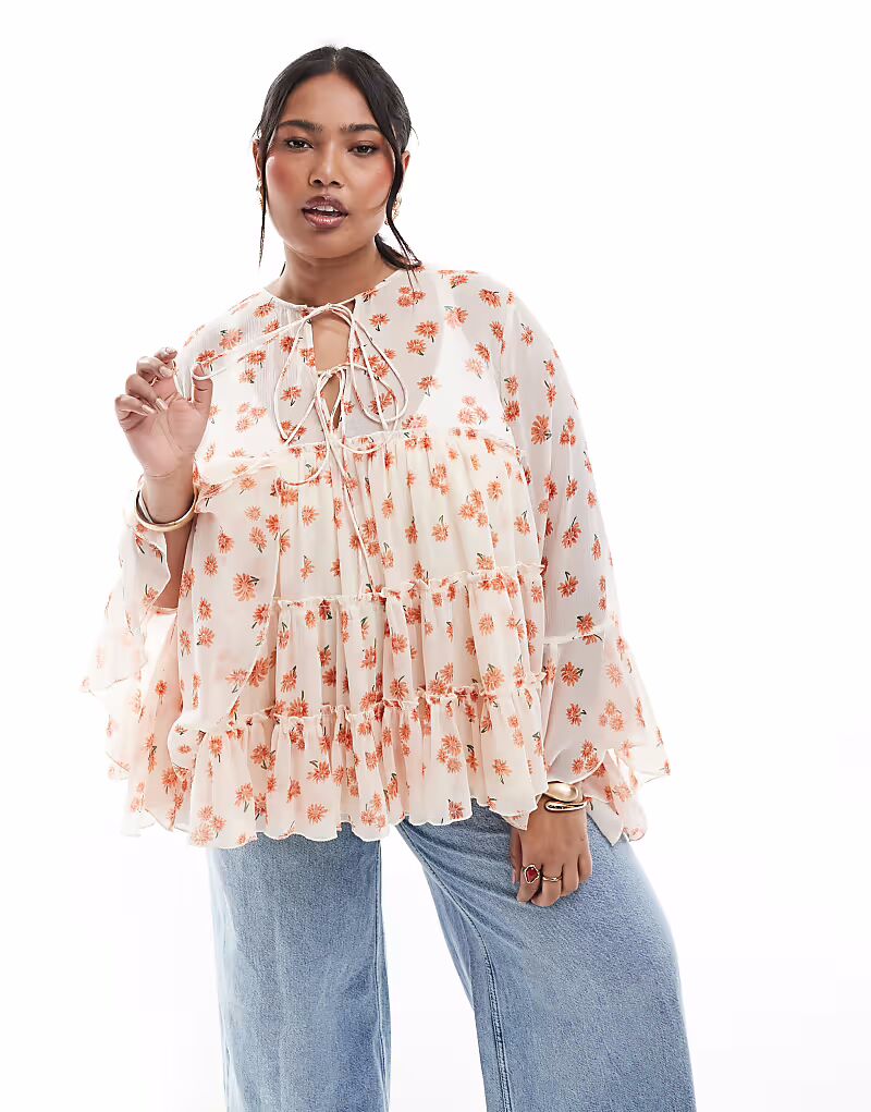 

Блузка ASOS DESIGN Curve с завязками спереди, оборками на манжетах и цветочным принтом