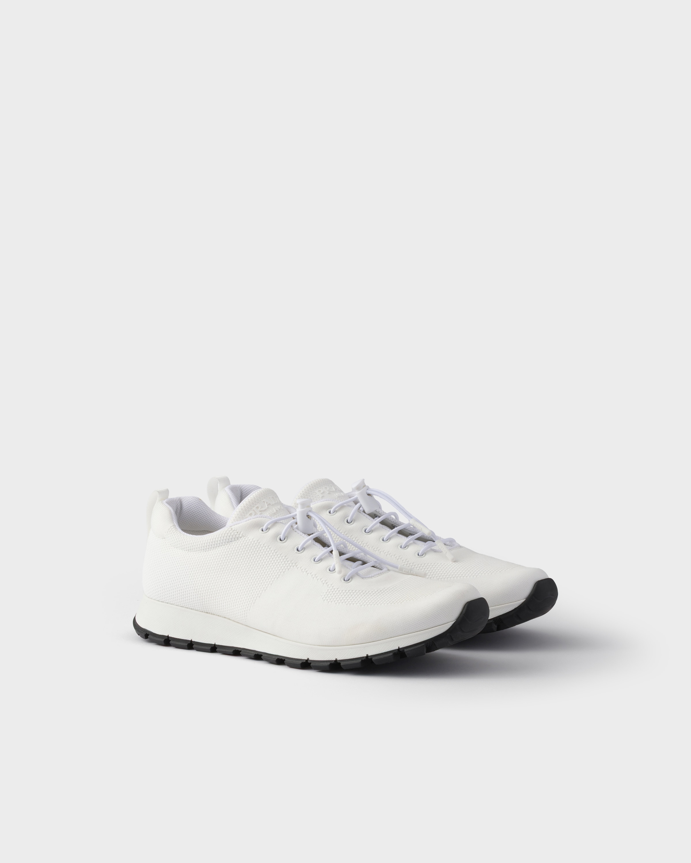 

Кроссовки из эластичного трикотажа Prada, белая