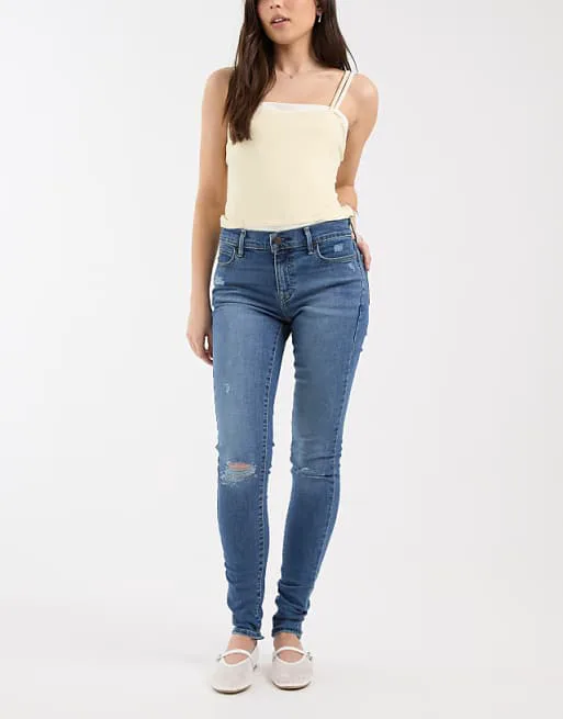 

Темно-синие джинсы суперскинни с рваными краями Levi's 710