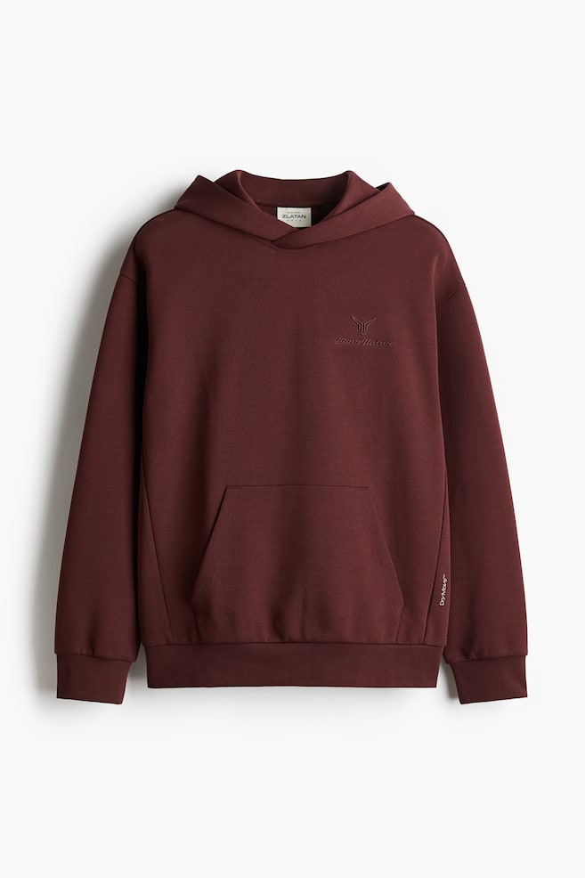 

Спортивная толстовка с капюшоном из материала DryMove свободного покроя. H&M, красный