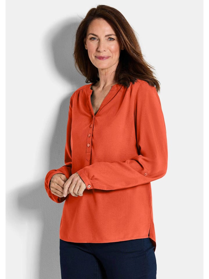 

Короткий размер: Туника Элегантная вискозная блузка с V-образным вырезом терракотового цвета. GOLDNER